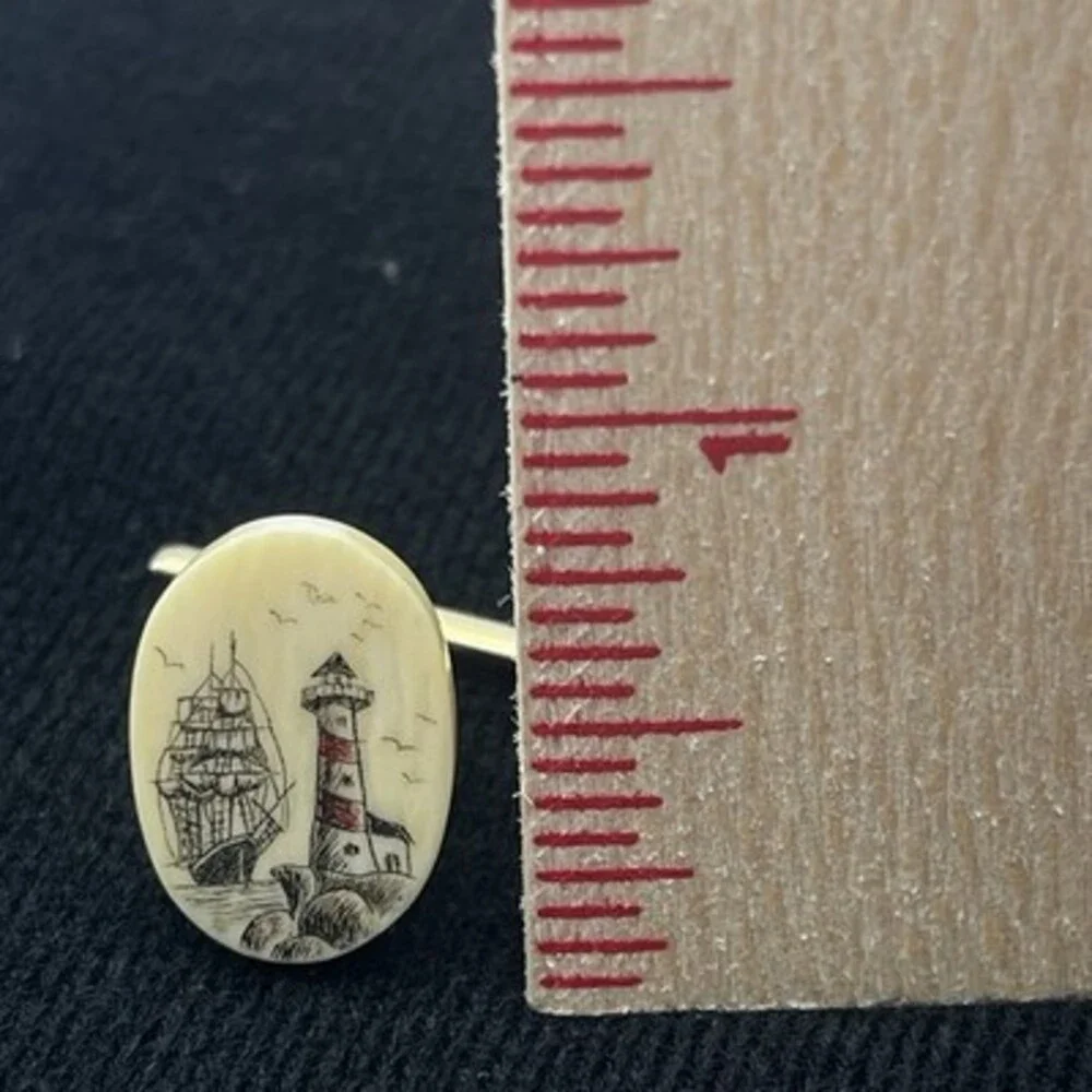 2 VTG scrimshaw tie tacks featuring a detailed nautical Sailboat And Lighthouse